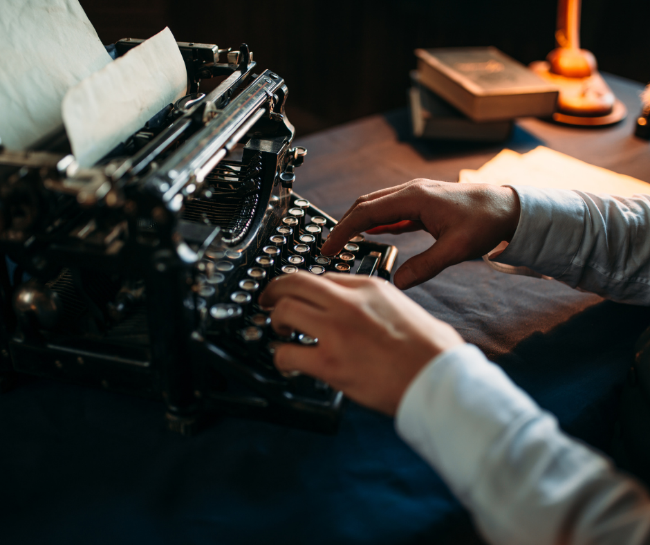 Author typing on typewriter