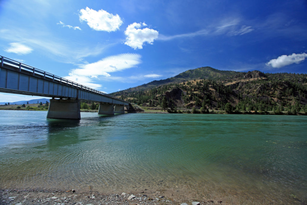 Highway 382 bridge over the Lower Flathead River near Perma, Montana. From 1954-1996, an eleven-inch steel pipe was suspended above the turquoise waters next to the bridge, part of the 558-mile Yellowstone Pipeline linking refineries in Billings, Montana to Moses Lake, Washington.