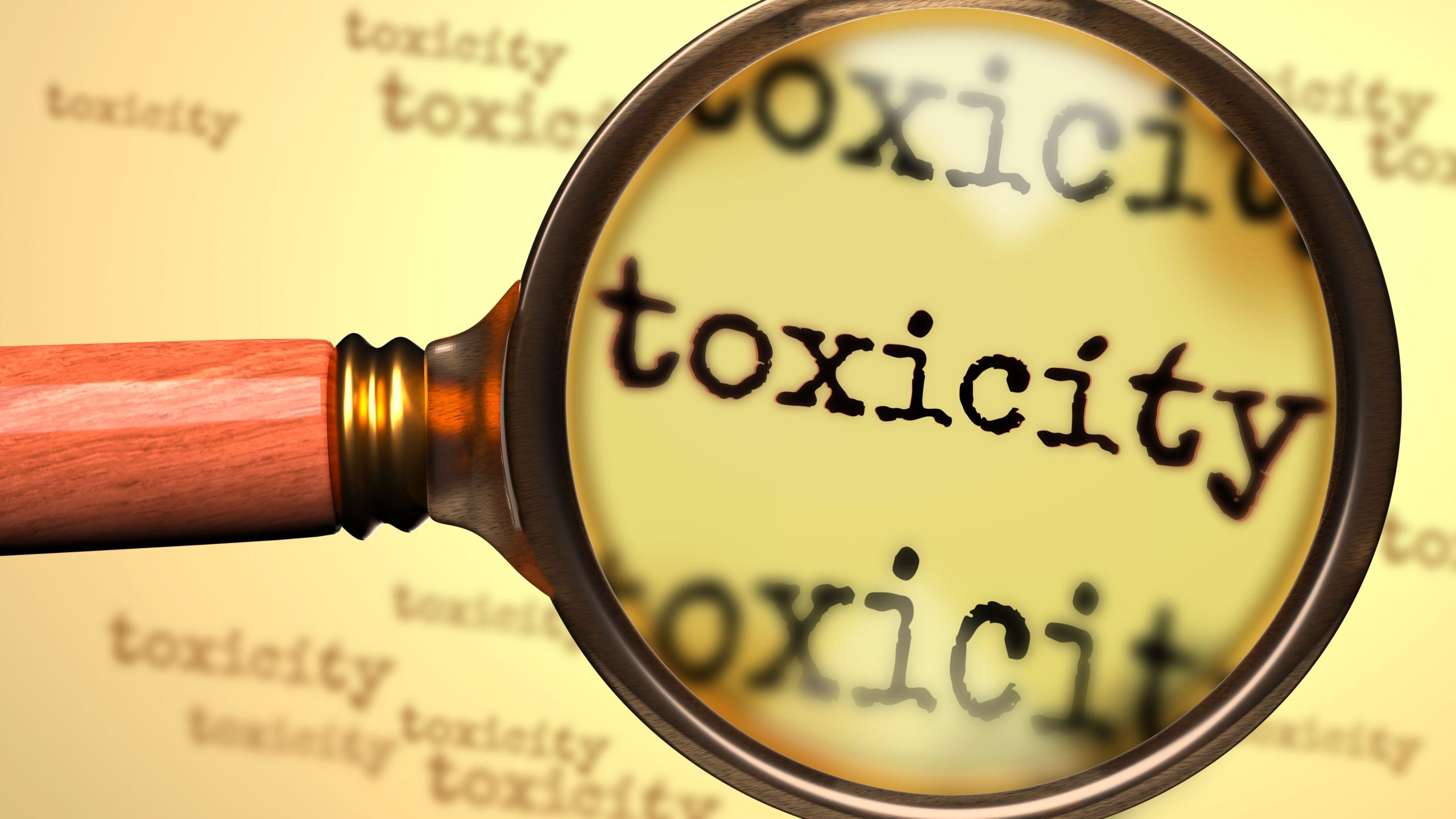 Toxicity - magnifying glass enlarging English word Toxicity to symbolize taking a closer look