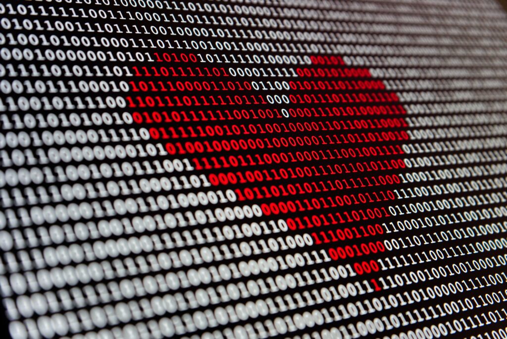 Binary code with a heart overlaid