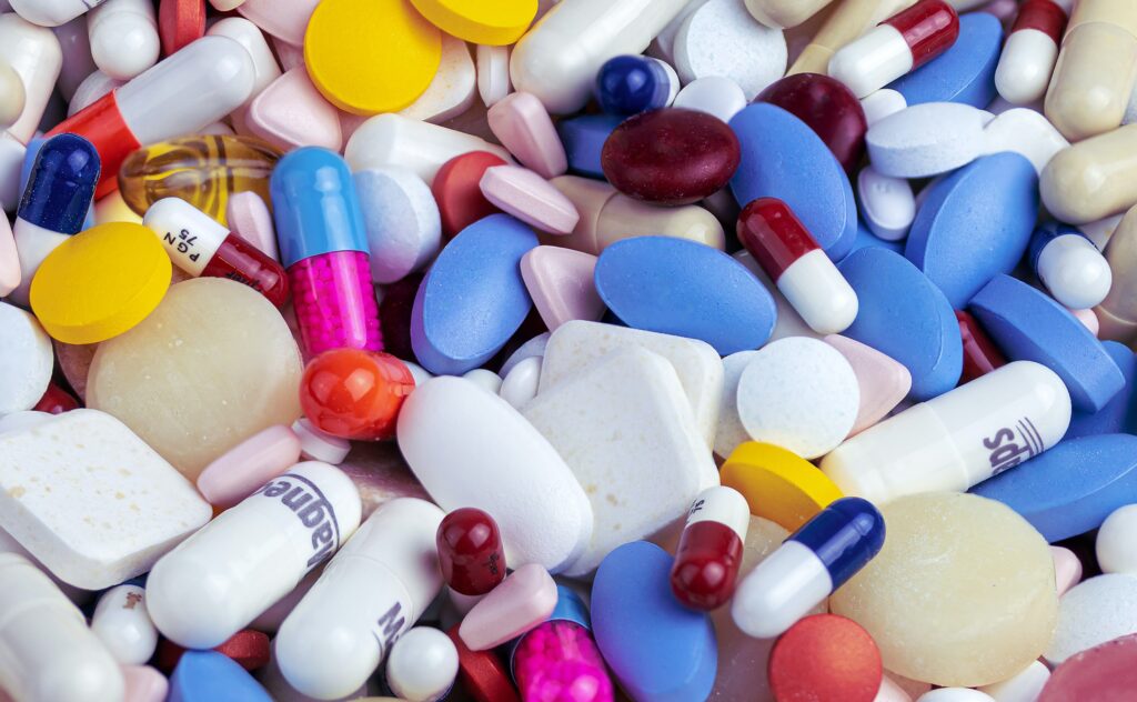 Multicoloured medication pills in assorted shapes and sizes