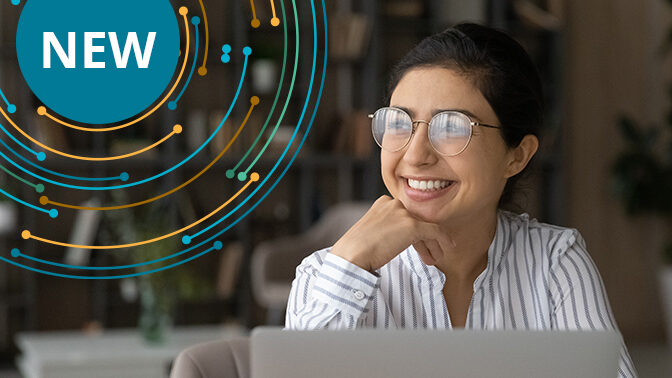 Happy person behind a laptop.