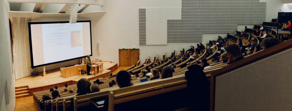 Lecture hall with lecturer and students. 
