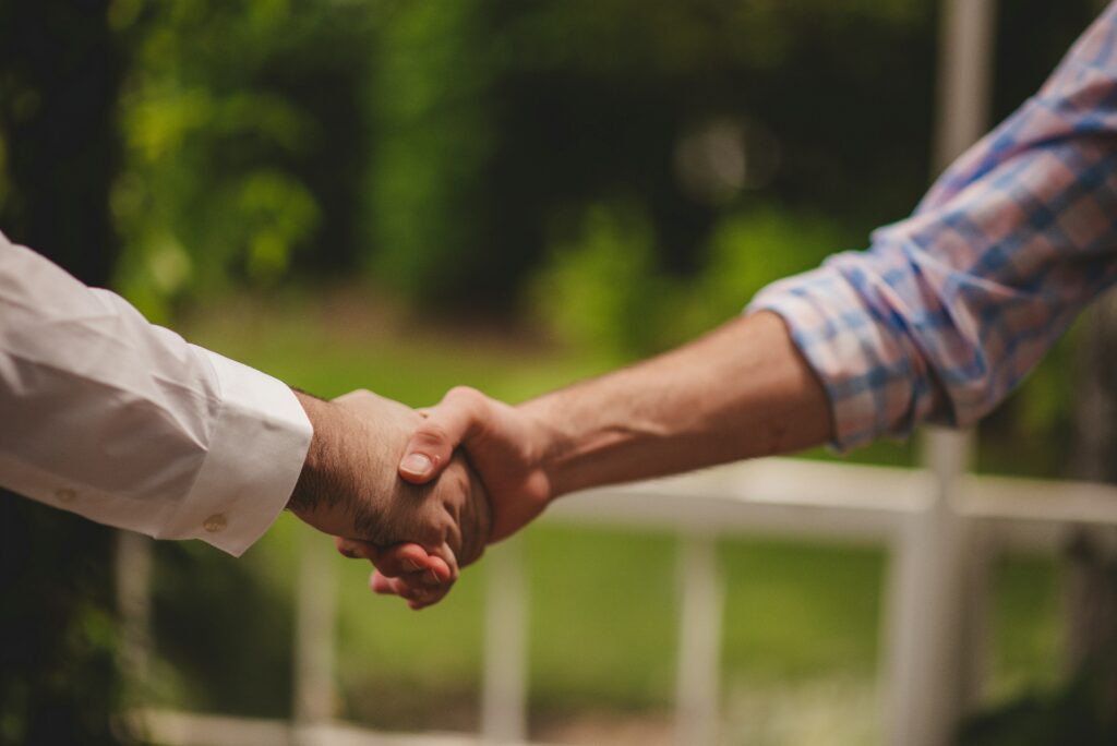 Two people shaking hands.